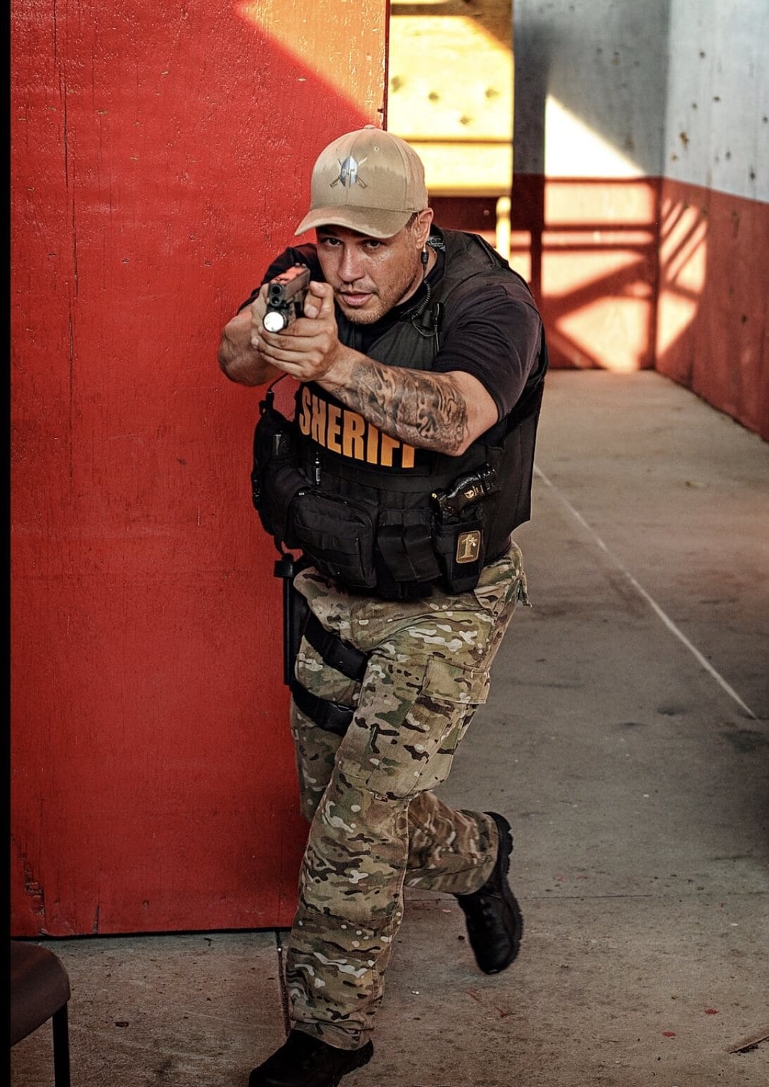 holding pistol walking towards danger